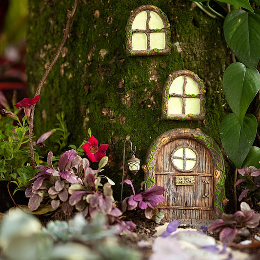 Enchanted fairy door kit featuring hand-painted woodland fairy door with Fairies Welcome sign and two glow in the dark windows