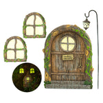 Tree Poetry enchanted fairy door mounted on a tree in a lush outdoor garden surrounded by ferns and ground cover