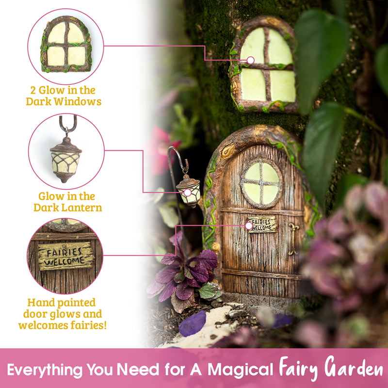 Fairy door kit laid flat showing all included pieces: door, two windows, bonus fairy lantern, and mounting hardware screws