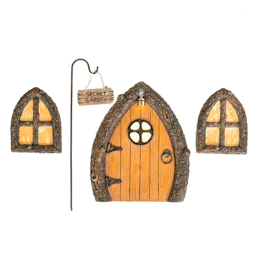 Hand-painted fairy door, window, and Secret Garden sign set displayed together on a mossy garden tree base